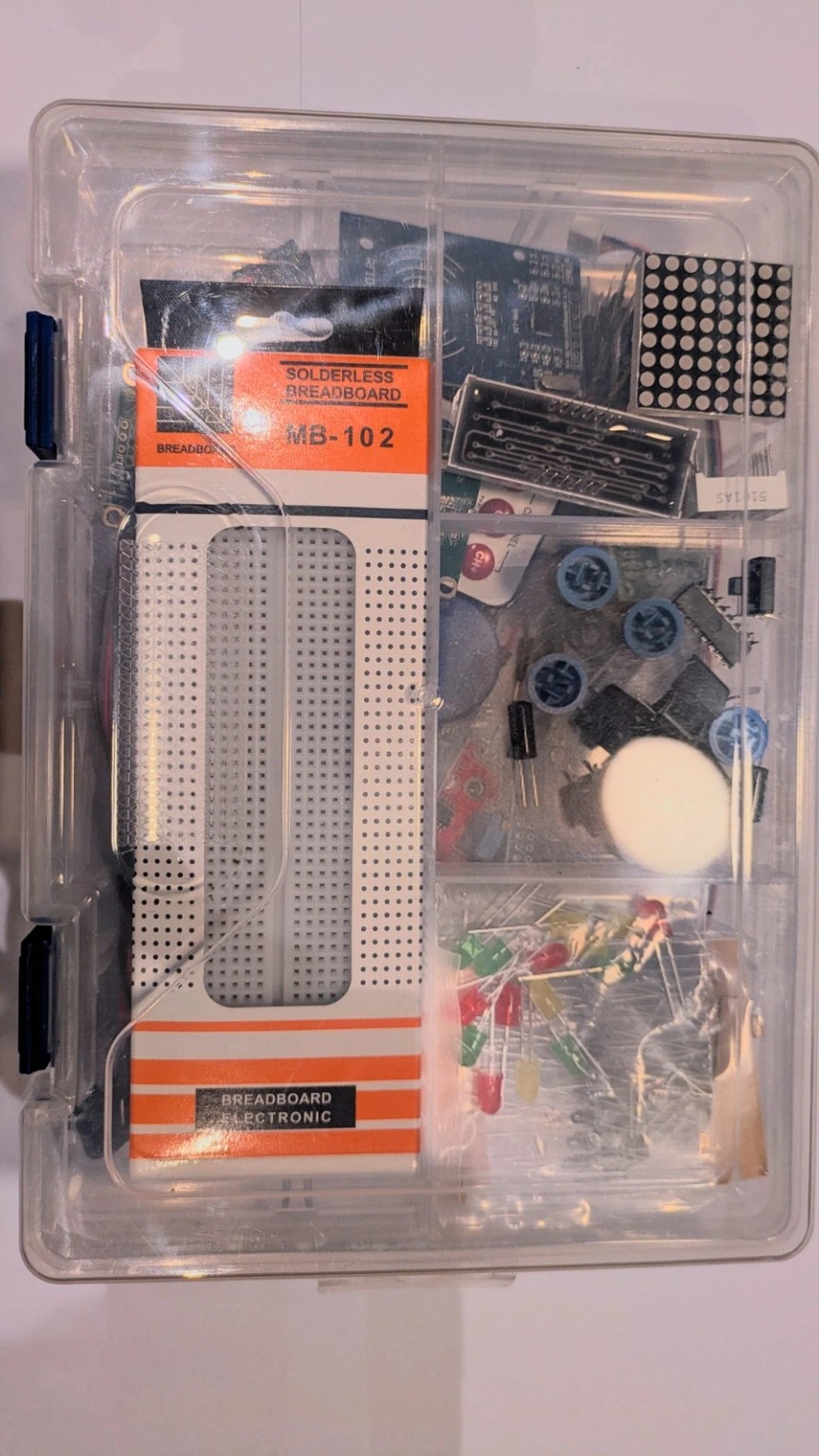 Arduino starter kit in a clear storage case